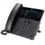 Black Polycom VVX business IP phone on a white table